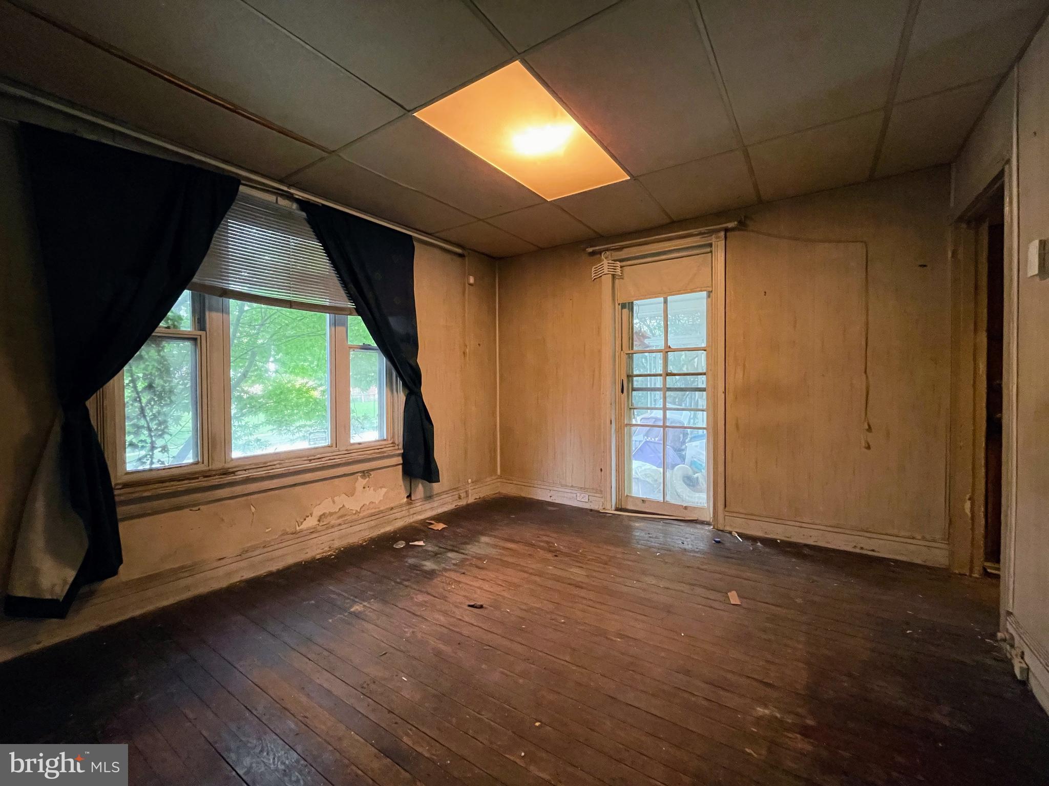 24 Westview Street Philadelphia, PA 19119 - Photo 5 of 13 an empty room with wooden floor and windows