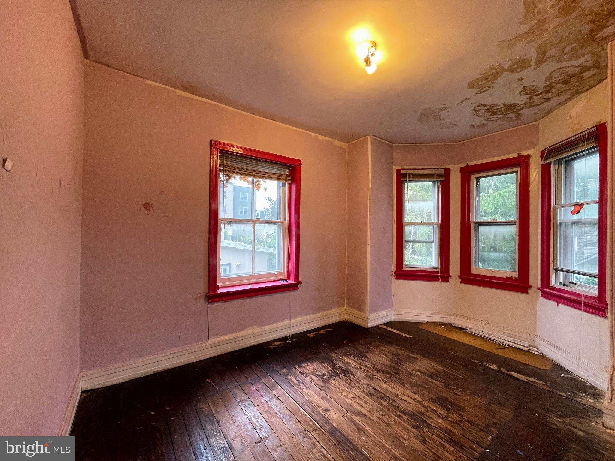 24 Westview Street Philadelphia, PA 19119 - Photo 7 of 13 an empty room with wooden floor and windows