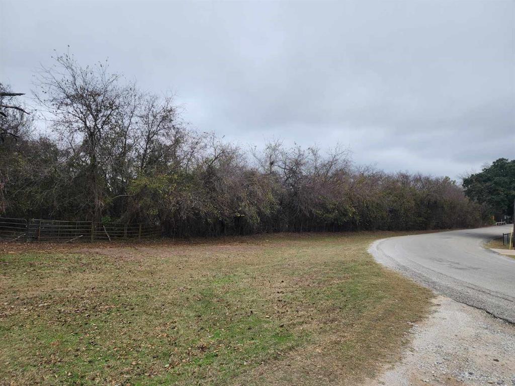 Tbd-2 Harmony Road Weatherford, TX 76087 - Photo 1 of 1 View of asphalt street featuring a wooded view