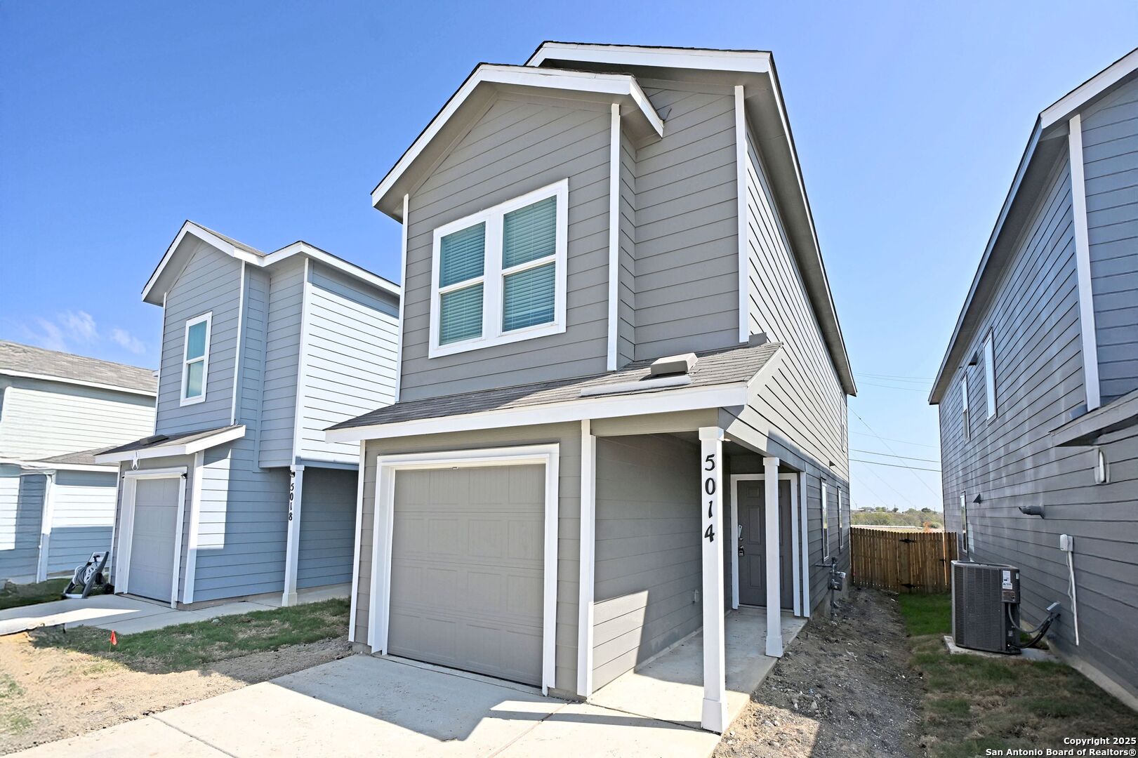 5014 Winecup Cove Converse, TX 78109 - Photo 2 of 25 a front view of a house with a yard
