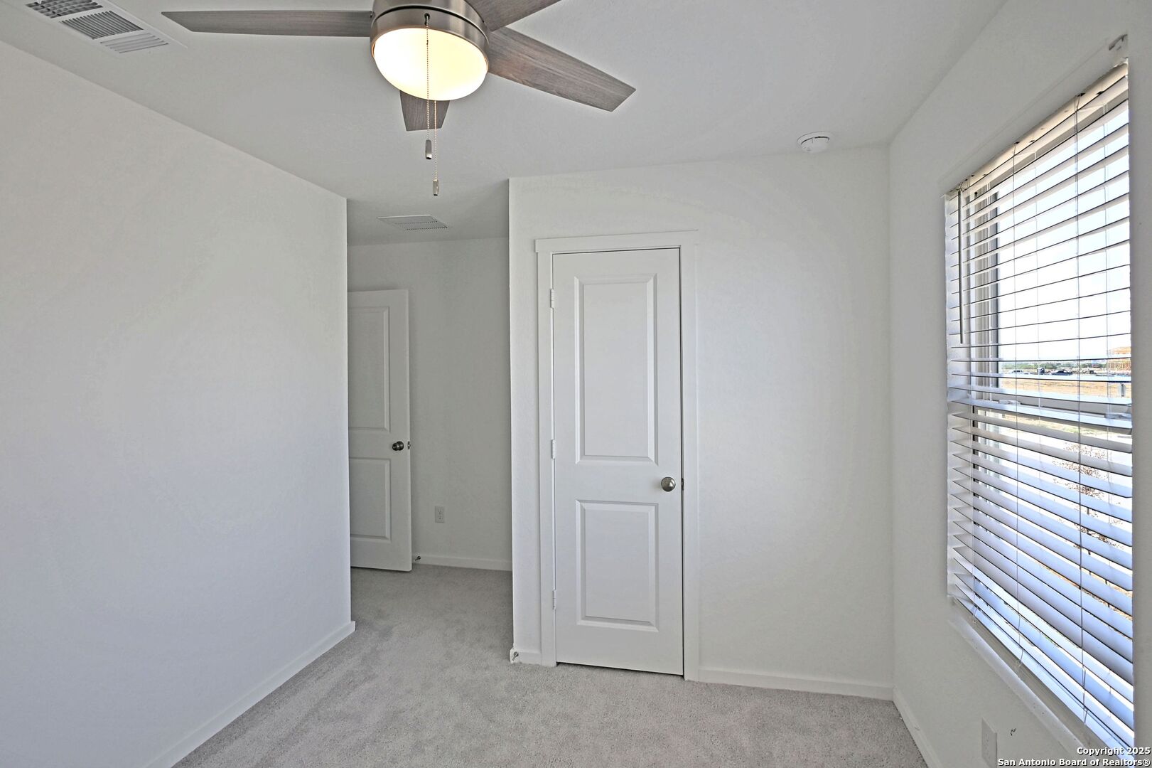 5014 Winecup Cove Converse, TX 78109 - Photo 24 of 25 a view of an empty room with a window