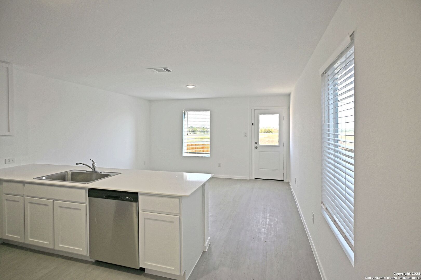 5014 Winecup Cove Converse, TX 78109 - Photo 4 of 25 a kitchen with a sink and cabinets