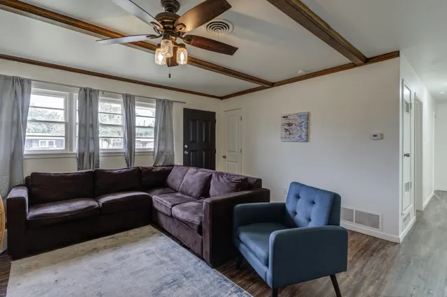 a living room with furniture and a window