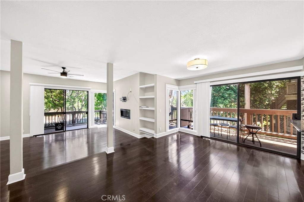 9 Madrona Irvine, CA 92612 - Photo 7 of 38 a view of an empty room with wooden floor and a window