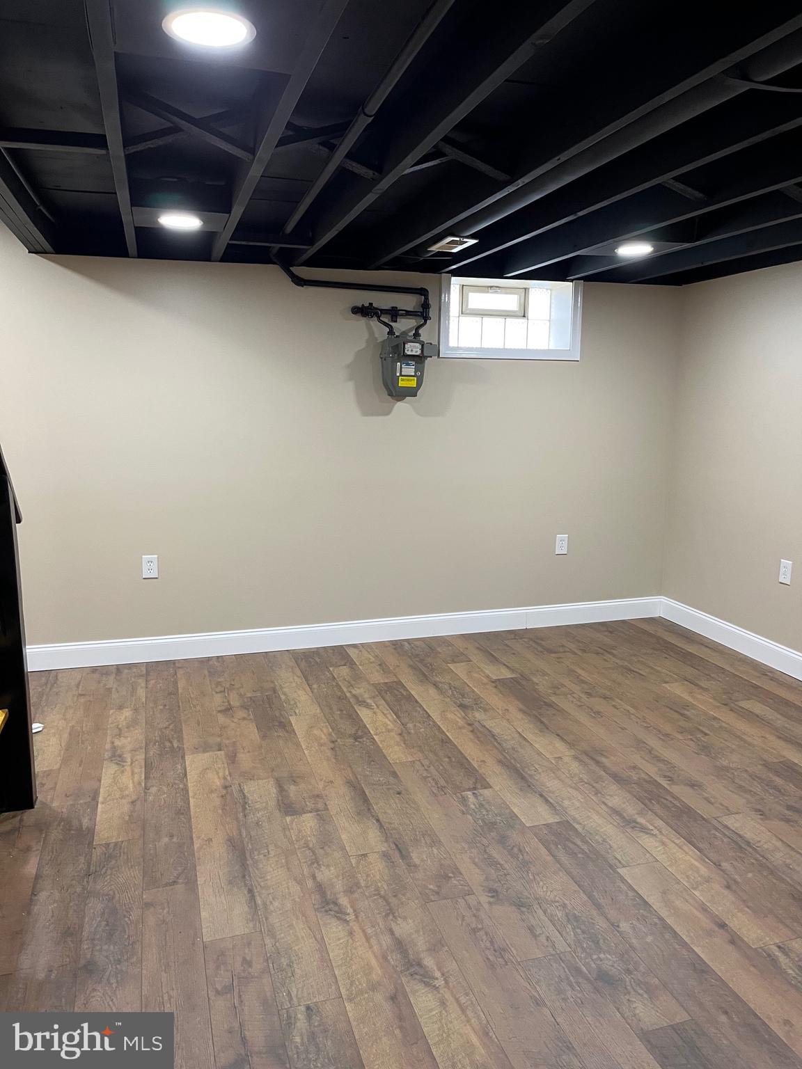 4865 Melbourne Road Baltimore, MD 21229 - Photo 17 of 19 a view of a room with wooden floor