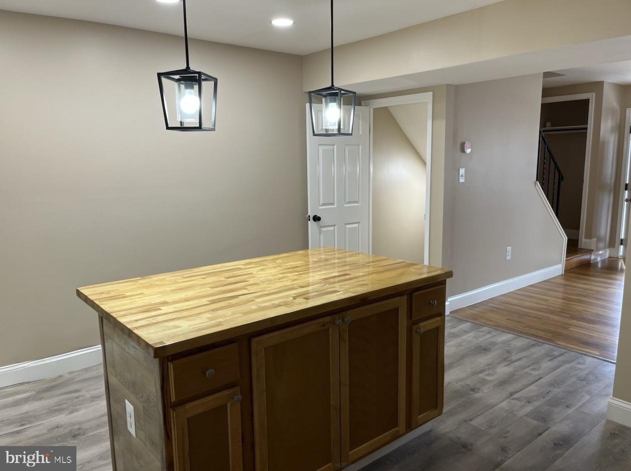 4865 Melbourne Road Baltimore, MD 21229 - Photo 4 of 19 an empty room with wooden floor