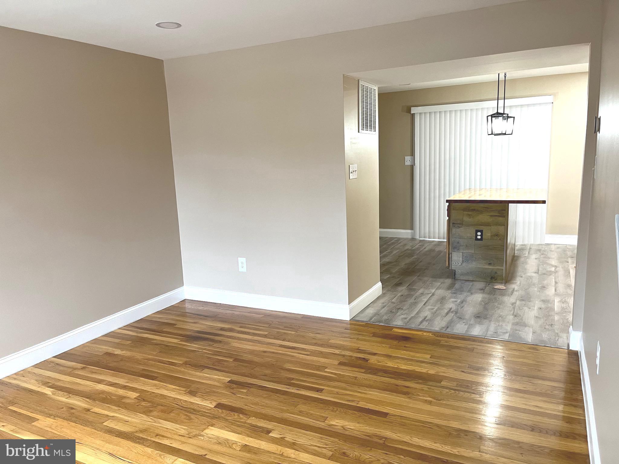 4865 Melbourne Road Baltimore, MD 21229 - Photo 7 of 19 a view of a livingroom with wooden floor