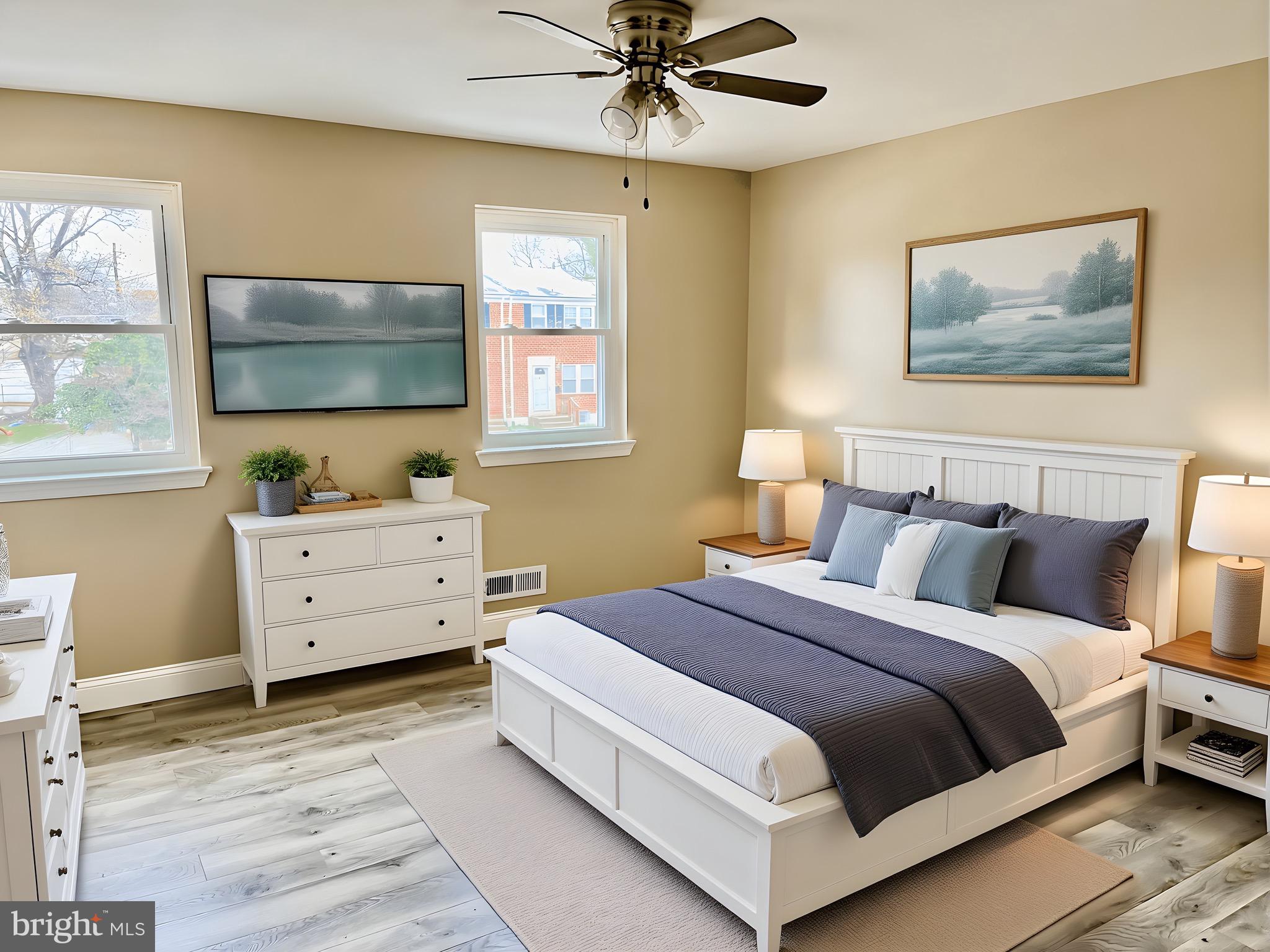 4865 Melbourne Road Baltimore, MD 21229 - Photo 10 of 19 a bedroom with a bed and a flat screen tv
