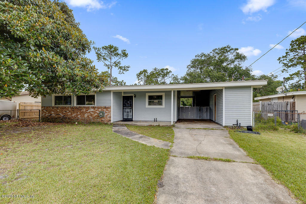 10453 Agave Road Jacksonville, FL 32246 - Photo 2 of 23 front view of a house with a yard