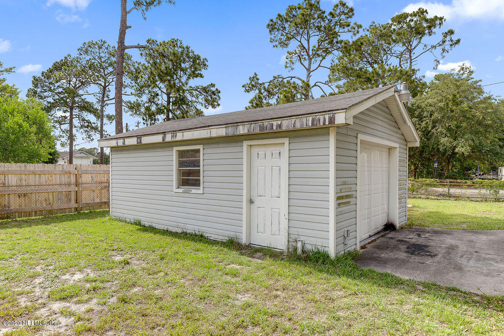 10453 Agave Road Jacksonville, FL 32246 - Photo 23 of 23 a view of a house with a yard
