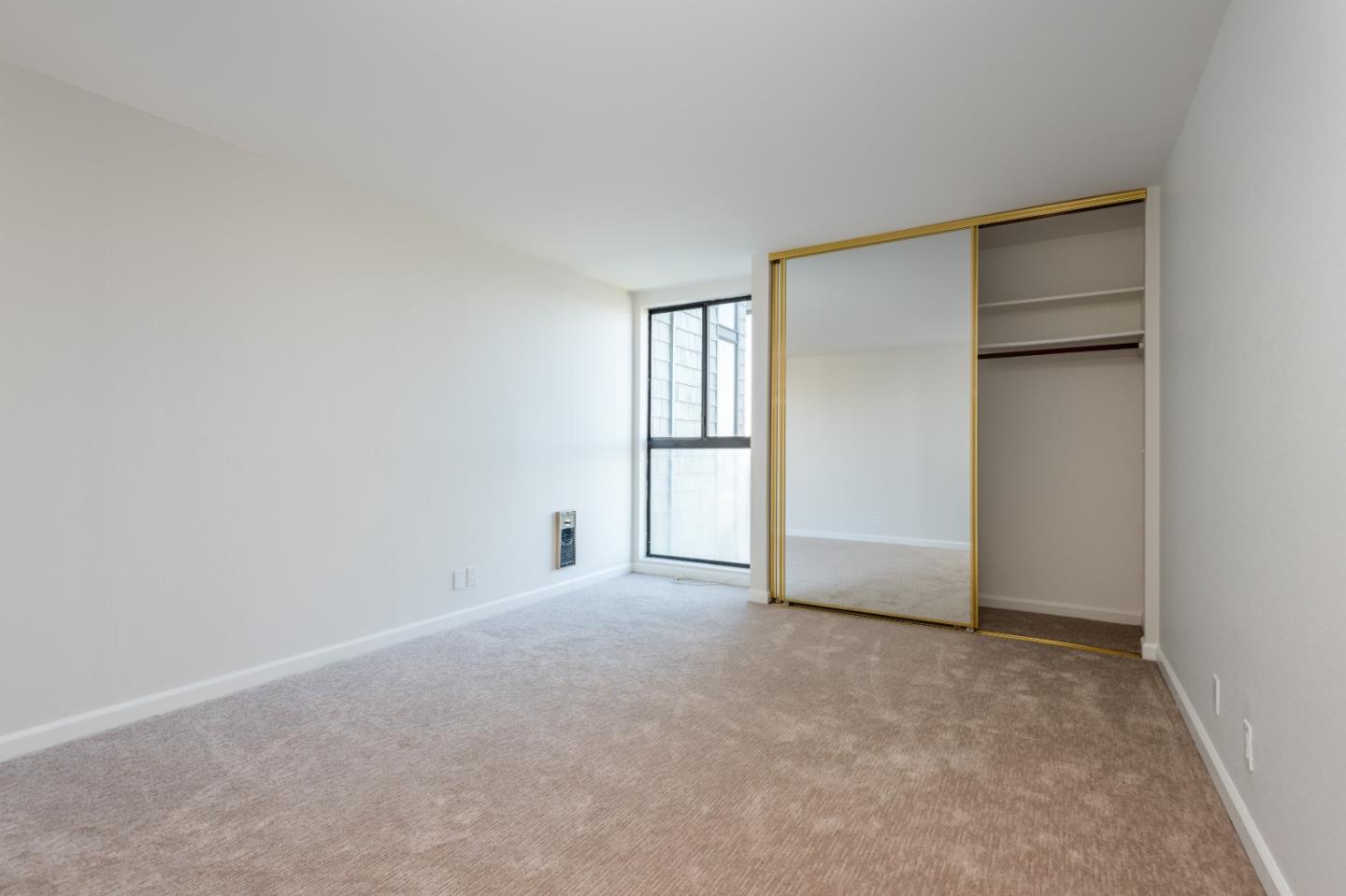 425 Anchor Road, Unit 317 San Mateo, CA 94404 - Photo 16 of 35 a view of an empty room with a window