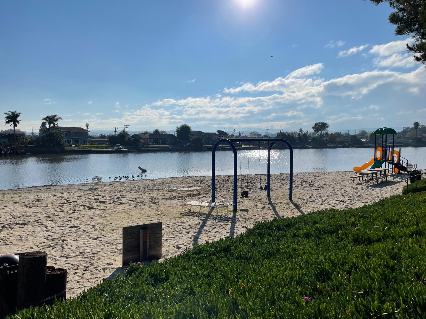 425 Anchor Road, Unit 317 San Mateo, CA 94404 - Photo 31 of 35 a view of a lake with houses in back