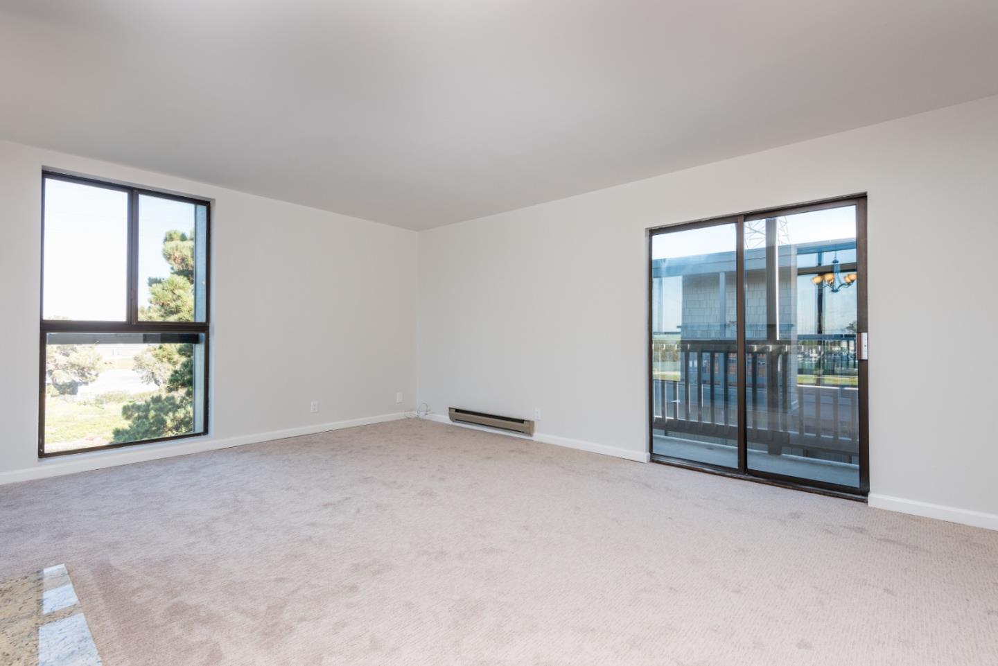 425 Anchor Road, Unit 317 San Mateo, CA 94404 - Photo 7 of 35 an empty room with sliding door