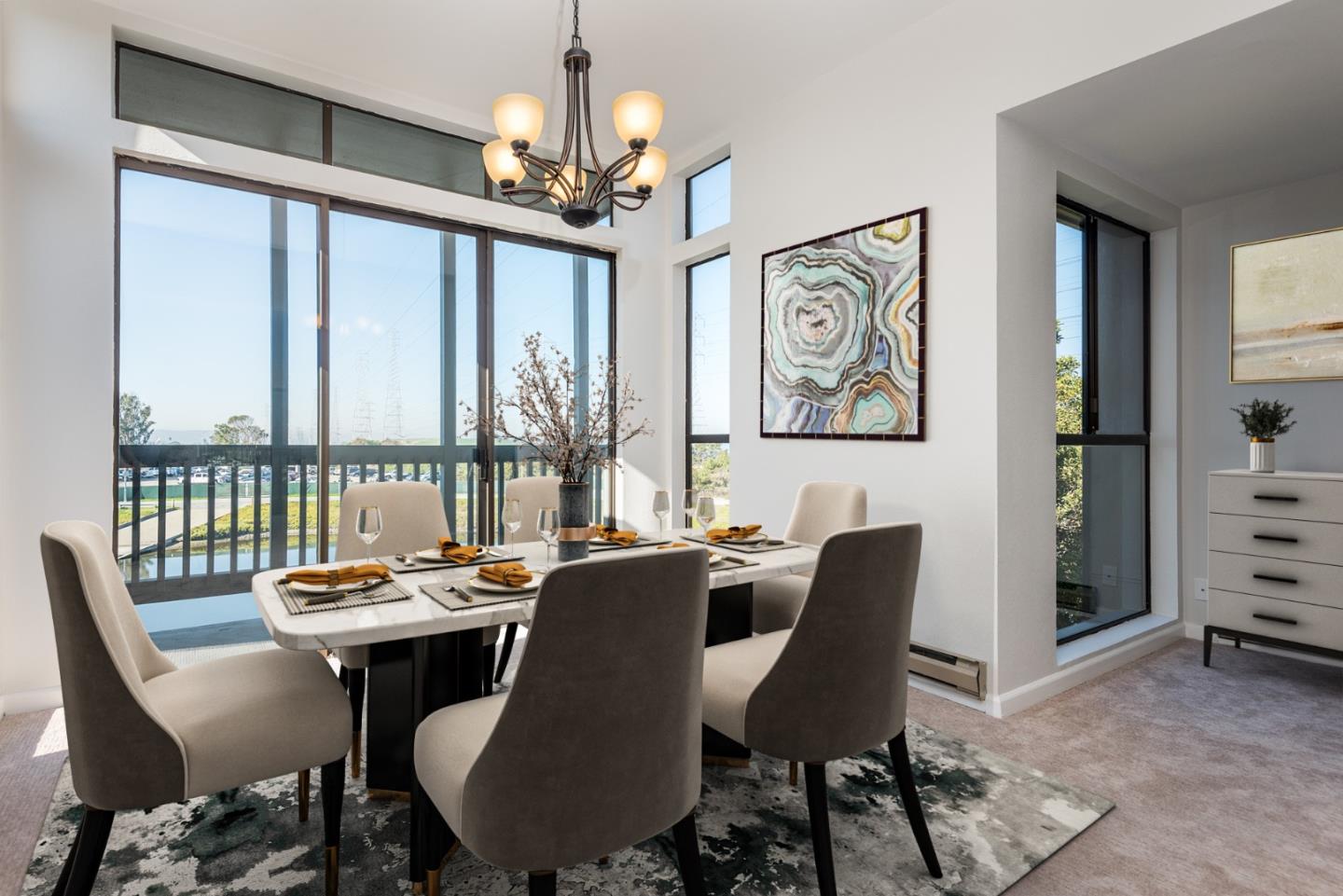 425 Anchor Road, Unit 317 San Mateo, CA 94404 - Photo 9 of 35 a view of a dining room with furniture large window and wooden floor