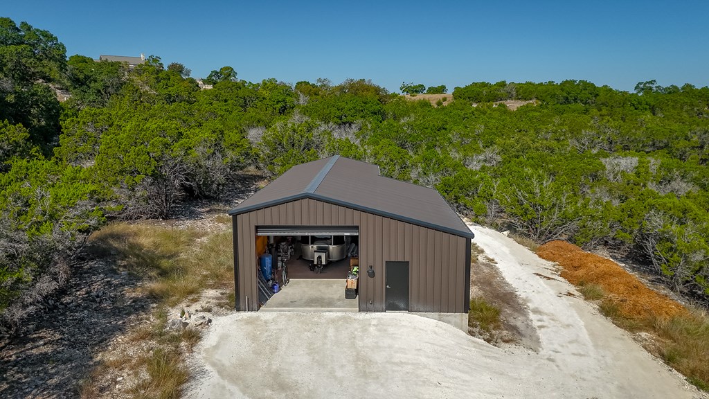 199 Hermosa Road Southwest Hunt, TX 78024 - Photo 32 of 59 a front view of a house with a yard