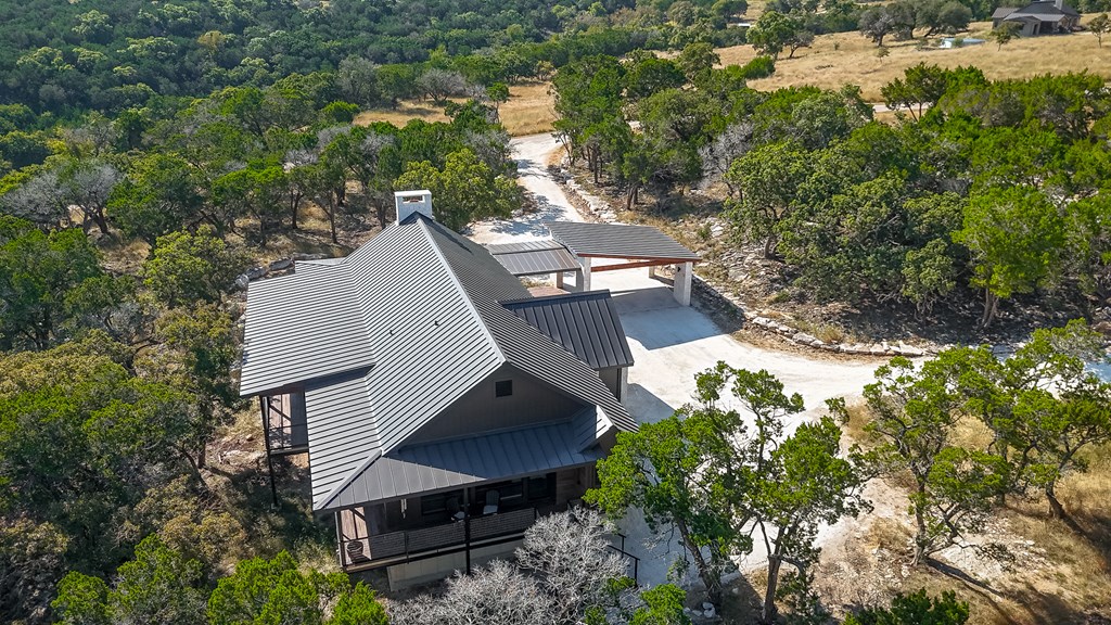 199 Hermosa Road Southwest Hunt, TX 78024 - Photo 45 of 59 a view of a house with a yard and sitting area