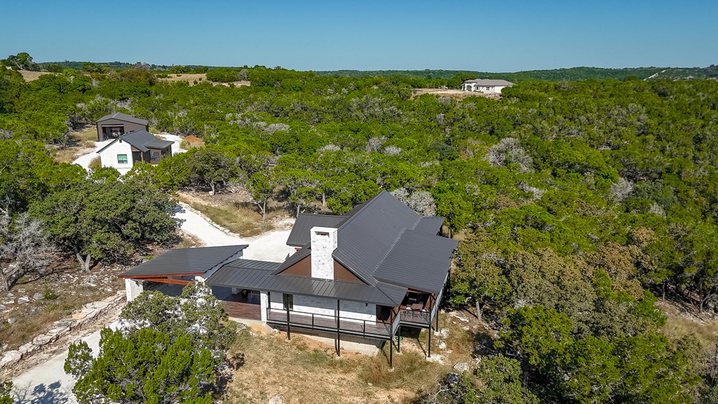 199 Hermosa Road Southwest Hunt, TX 78024 - Photo 46 of 59 a backyard of a house with table and chairs