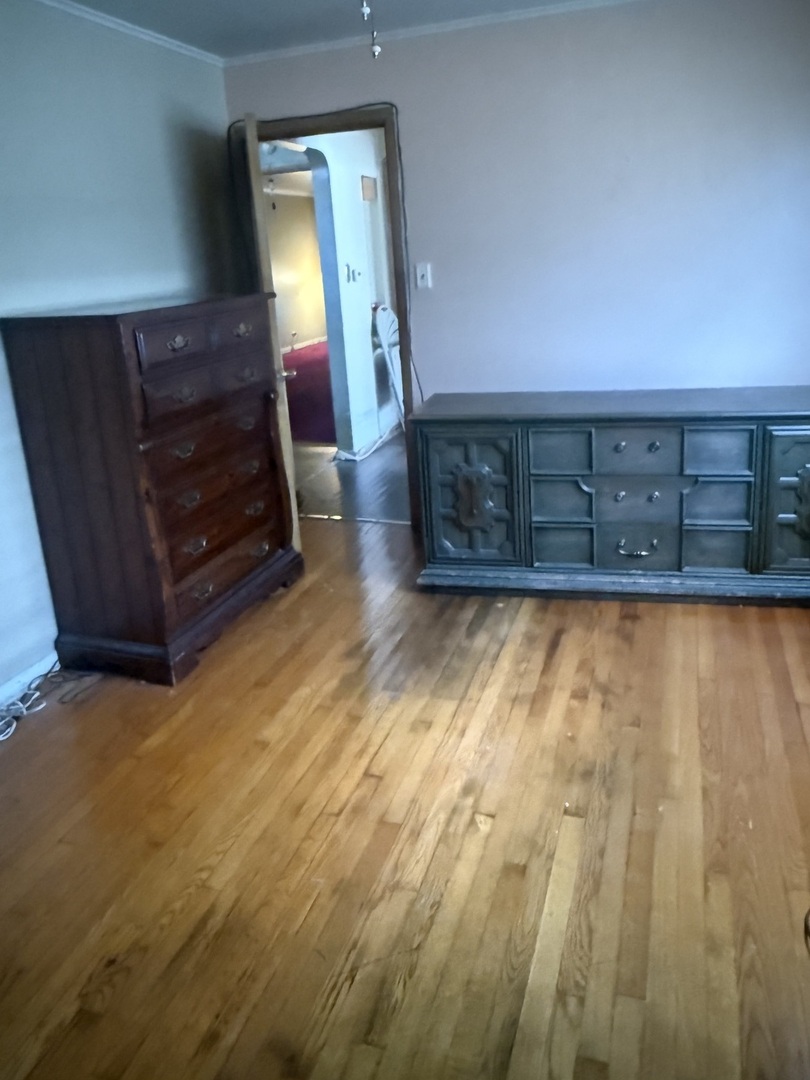 10553 South Calumet Avenue Chicago, IL 60628 - Photo 15 of 21 a view of a room with wooden walls