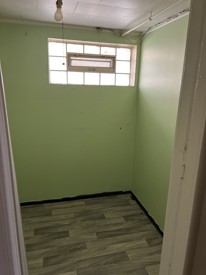 10553 South Calumet Avenue Chicago, IL 60628 - Photo 8 of 21 a view of empty room with window and entryway