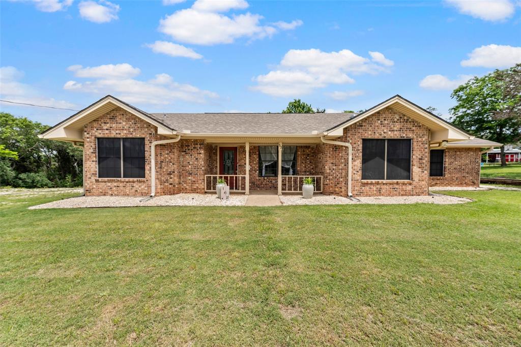 162 High Ridge Drive Bruceville, TX 76630 - Photo 3 of 40 a front view of house with yard and green space