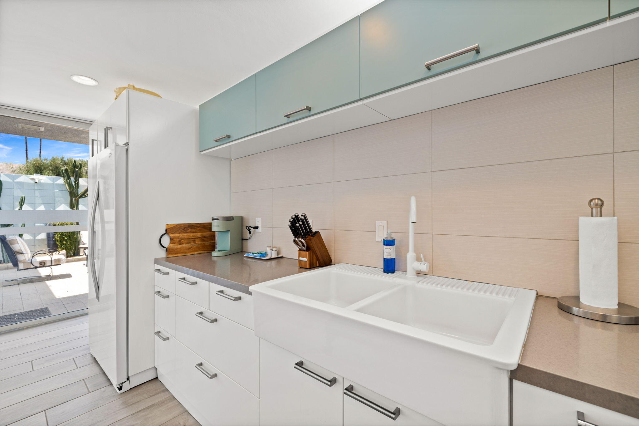 72857 El Paseo, Unit 502 Palm Desert, CA 92260 - Photo 15 of 48 a kitchen with appliances a sink and cabinets