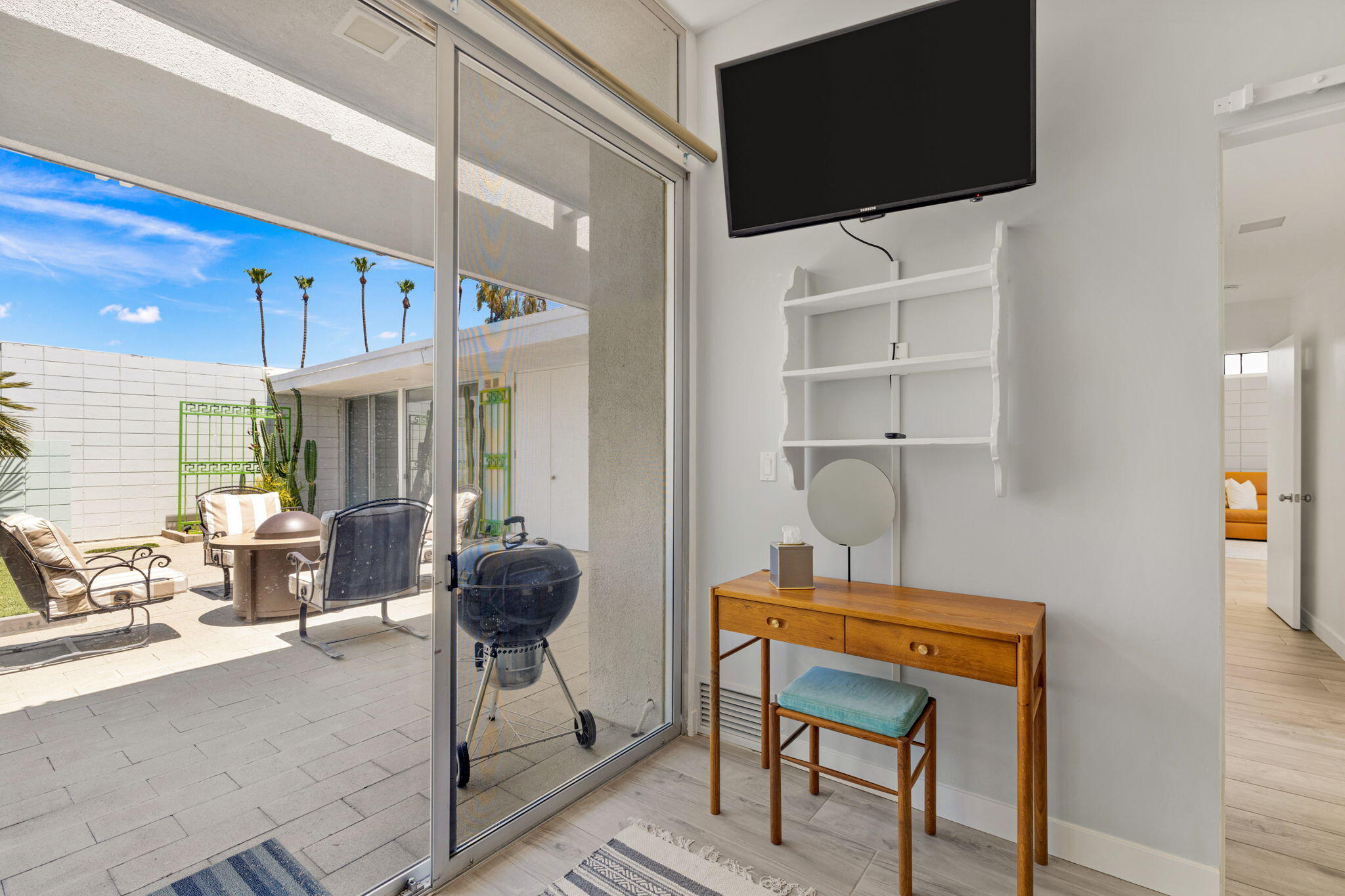 72857 El Paseo, Unit 502 Palm Desert, CA 92260 - Photo 21 of 48 a room with furniture and a flat screen tv