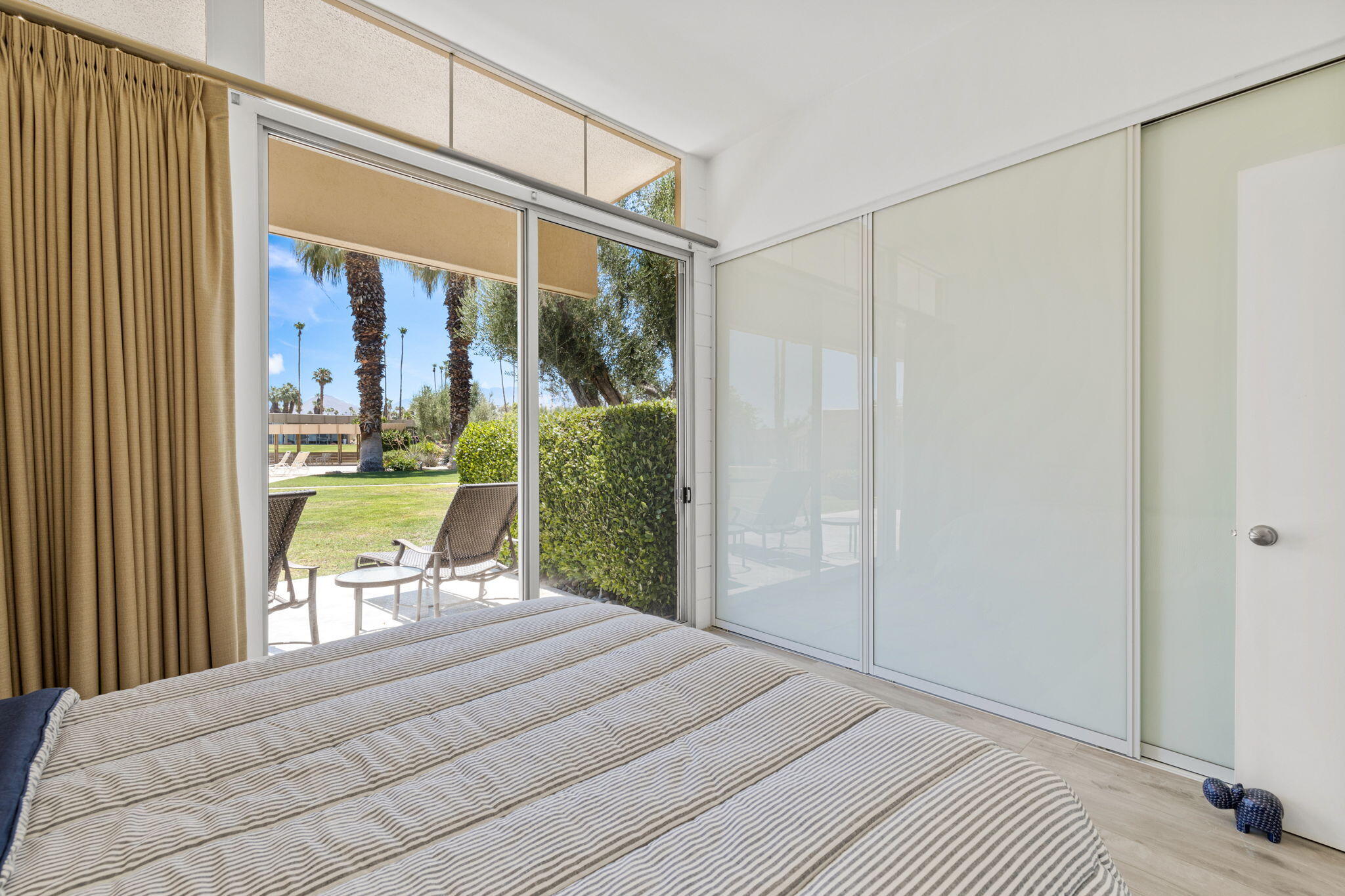 72857 El Paseo, Unit 502 Palm Desert, CA 92260 - Photo 23 of 48 a bedroom with a bed and a window