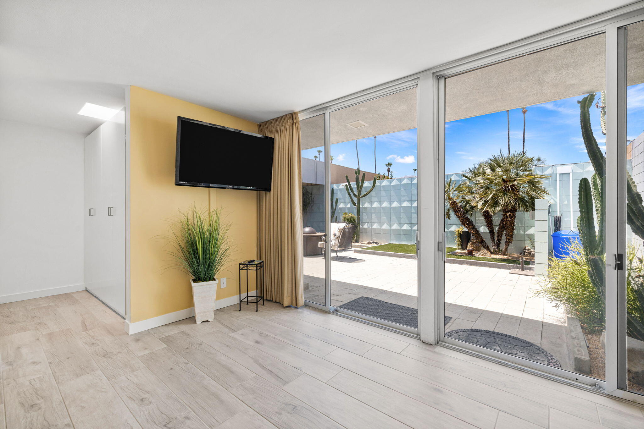 72857 El Paseo, Unit 502 Palm Desert, CA 92260 - Photo 28 of 48 a view of a living room and a flat screen tv
