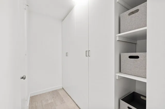 a view of an empty walk in closet