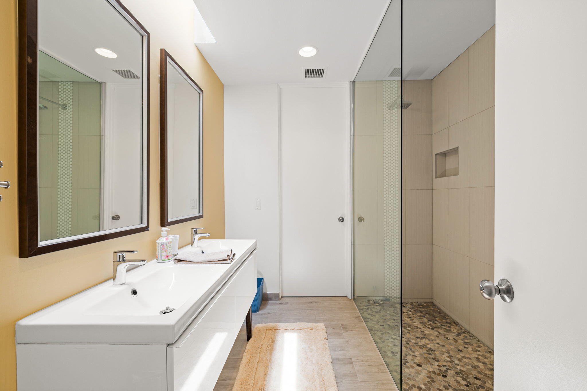 72857 El Paseo, Unit 502 Palm Desert, CA 92260 - Photo 33 of 48 a bathroom with a sink a toilet a mirror and shower