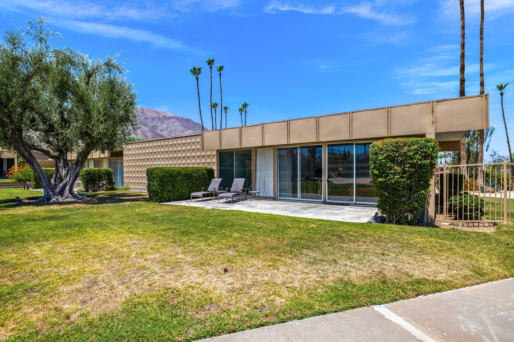 72857 El Paseo, Unit 502 Palm Desert, CA 92260 - Photo 41 of 48 a view of a house with backyard and sitting area
