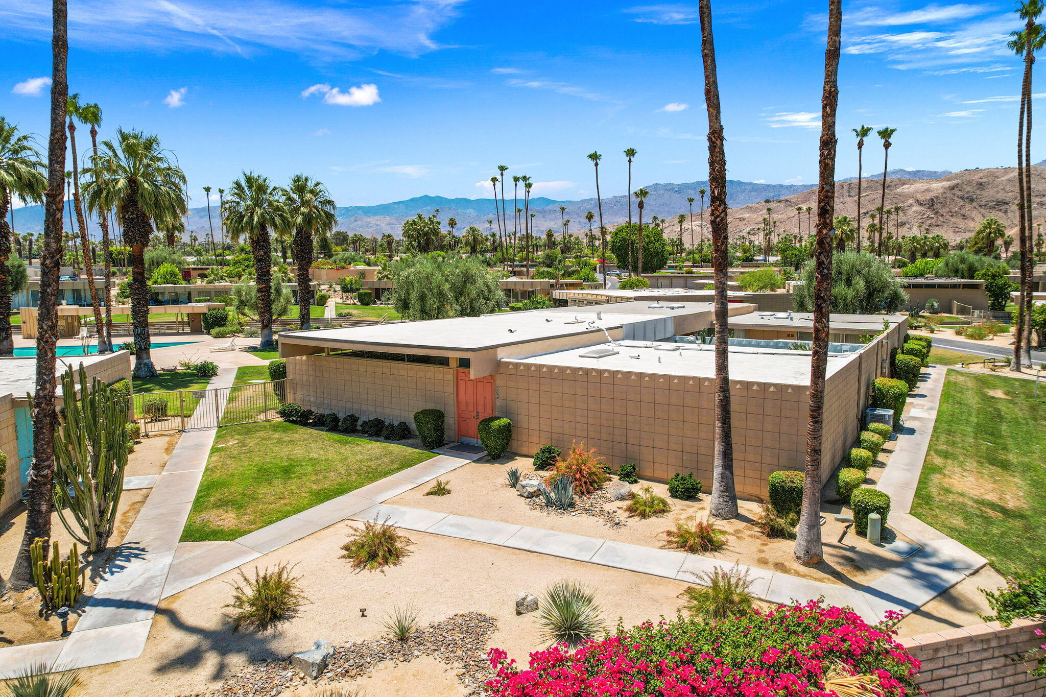 72857 El Paseo, Unit 502 Palm Desert, CA 92260 - Photo 42 of 48 a view of a patio with a table and chairs