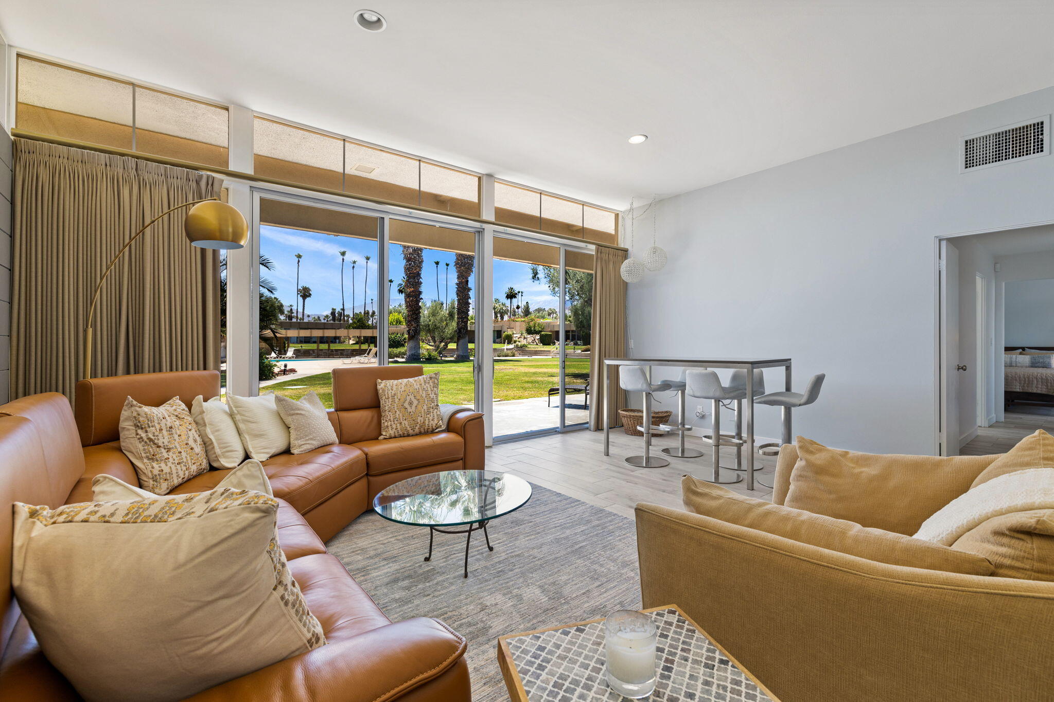 72857 El Paseo, Unit 502 Palm Desert, CA 92260 - Photo 5 of 48 a living room with furniture and a large window