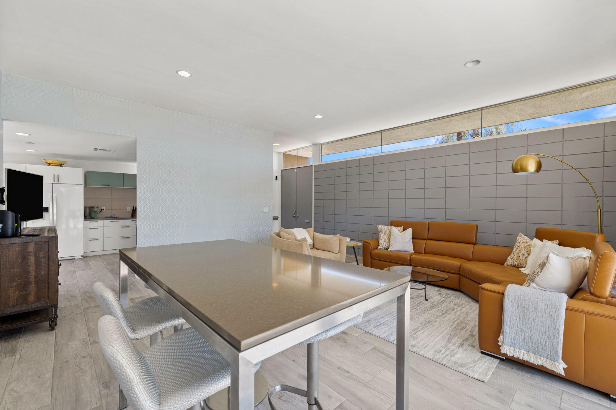 72857 El Paseo, Unit 502 Palm Desert, CA 92260 - Photo 9 of 48 a living room with furniture and kitchen view