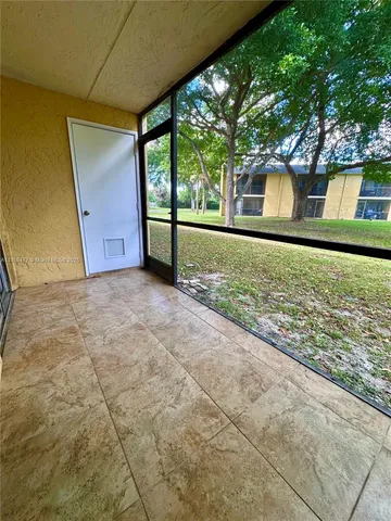 a view of a yard with an outdoor space