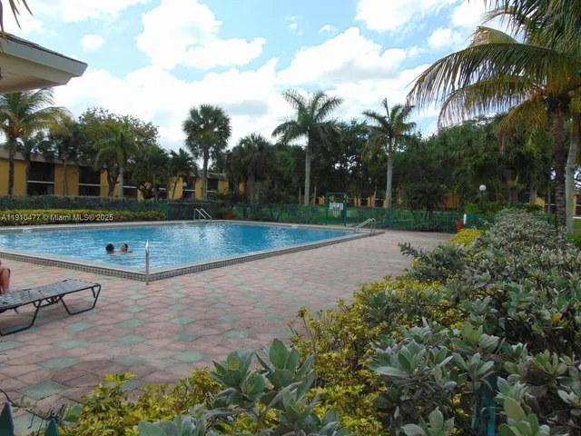 a view of house with a yard