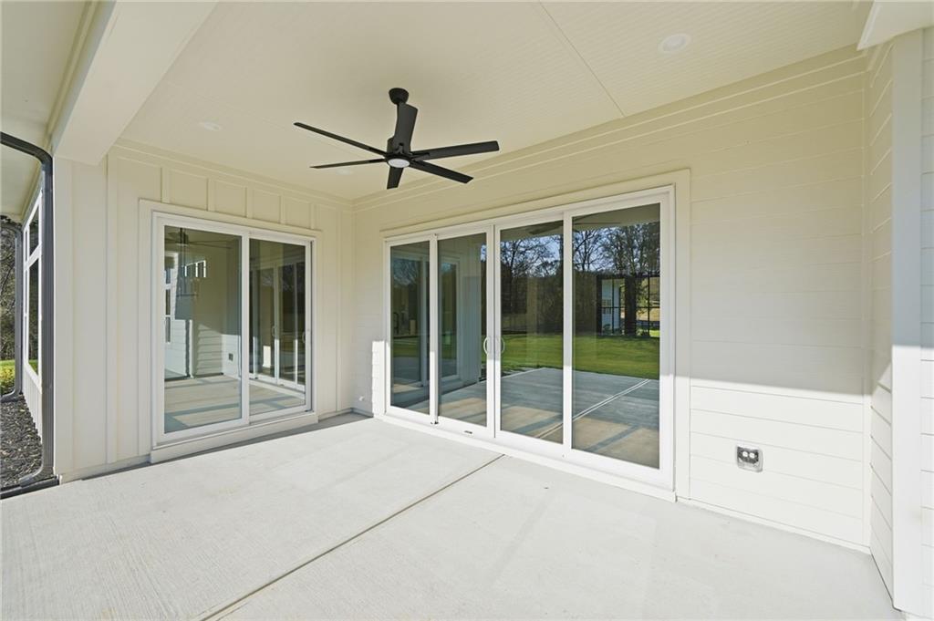 1248 Avery Road Canton, GA 30115 - Photo 13 of 64 a view of a room with a large window and a ceiling fan