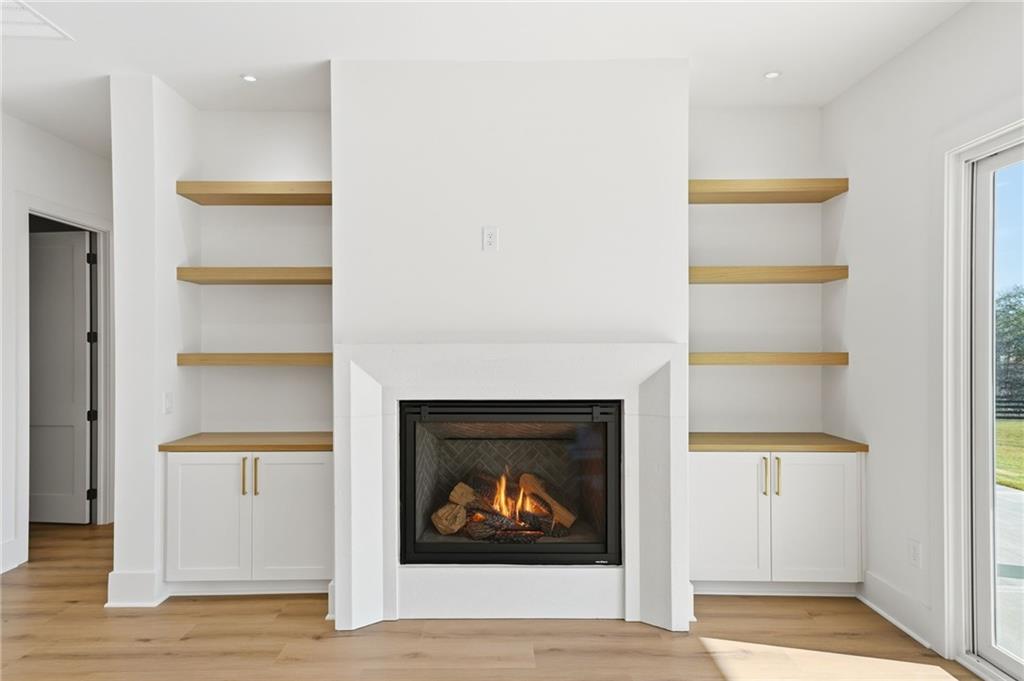 1248 Avery Road Canton, GA 30115 - Photo 17 of 64 a living room with furniture and a fireplace