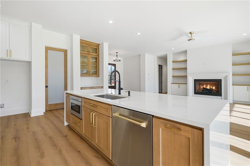 1248 Avery Road Canton, GA 30115 - Photo 27 of 64 a kitchen with stainless steel appliances a sink and a refrigerator