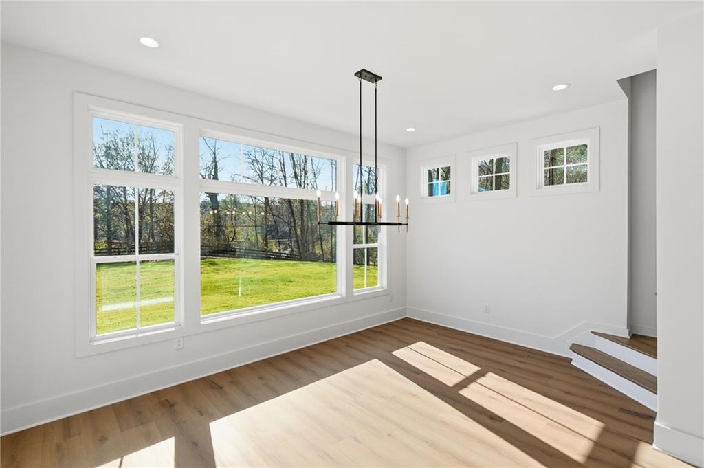 1248 Avery Road Canton, GA 30115 - Photo 29 of 64 a view of empty room with floor to ceiling window and ceiling fan