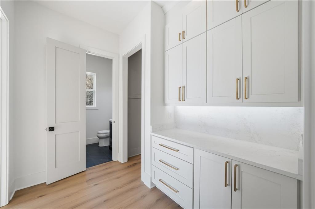 1248 Avery Road Canton, GA 30115 - Photo 32 of 64 a view of a kitchen with white cabinets