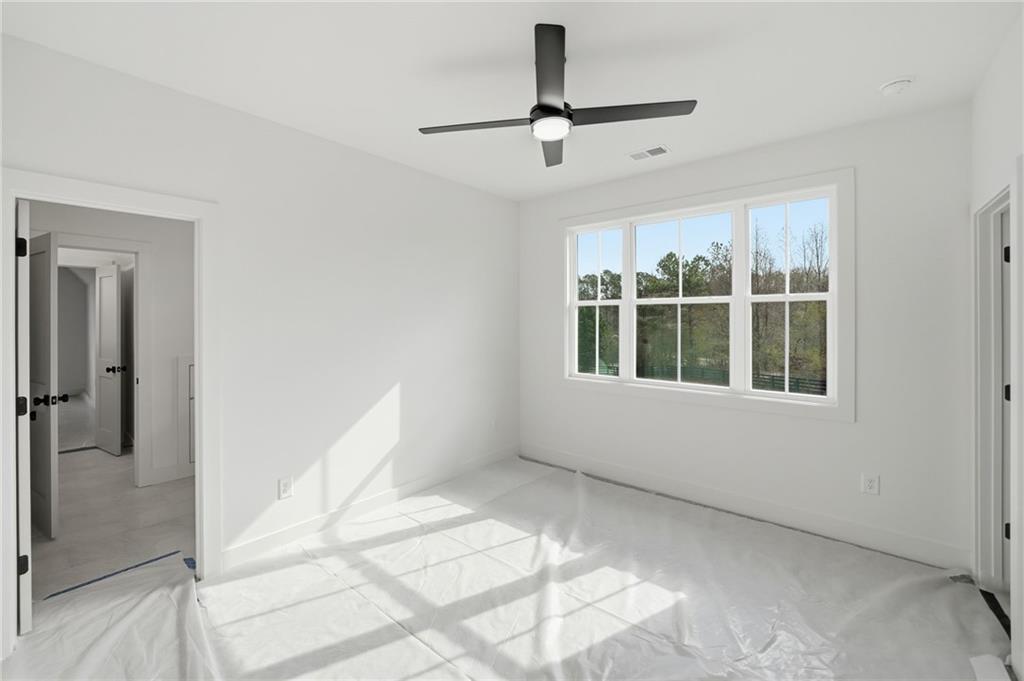 1248 Avery Road Canton, GA 30115 - Photo 56 of 64 a view of an empty room with a window