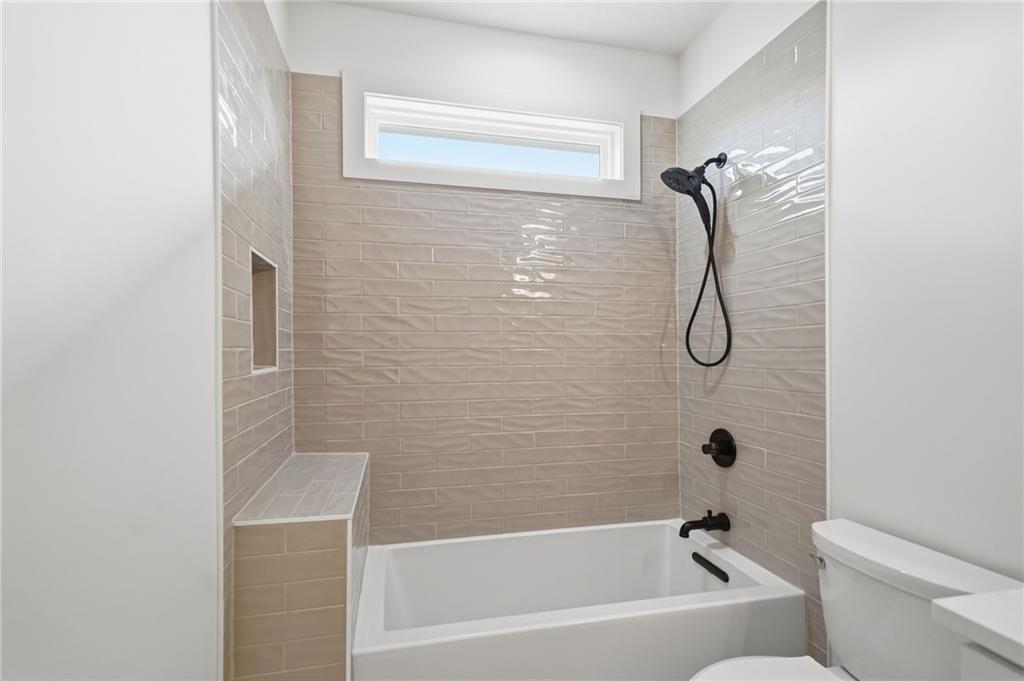 1248 Avery Road Canton, GA 30115 - Photo 58 of 64 a bathroom with a shower a toilet and a window