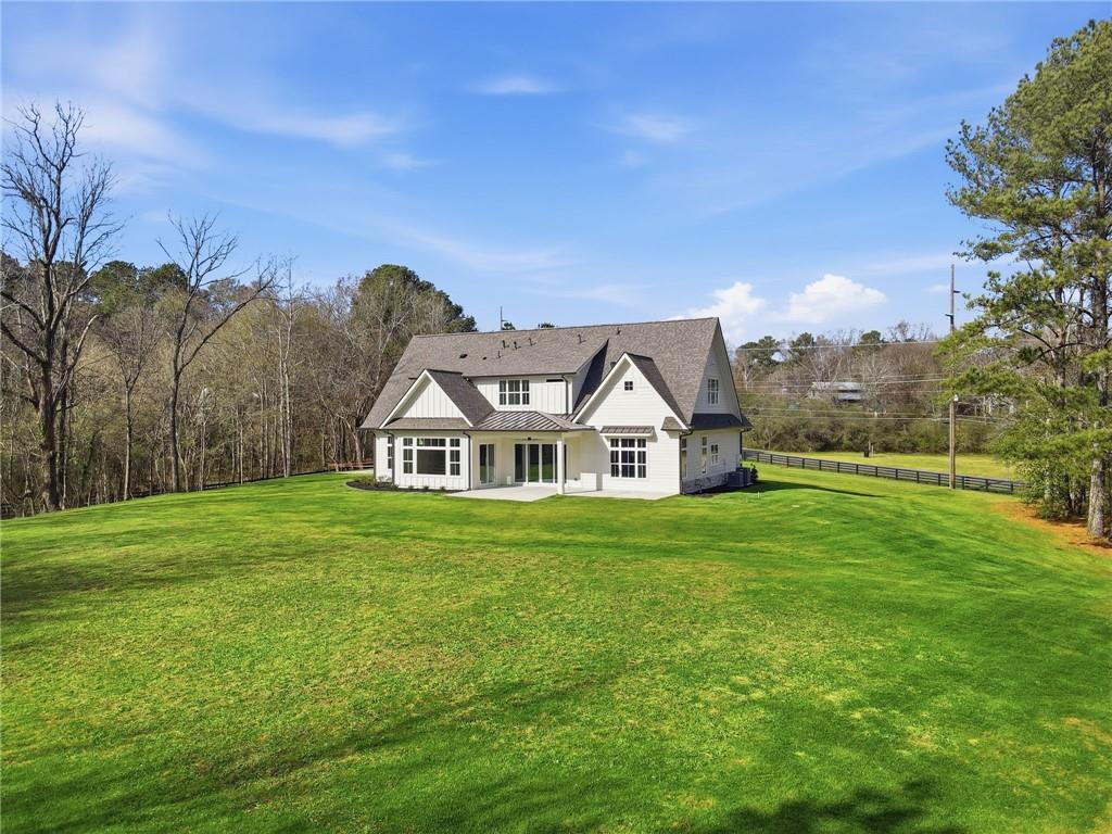 1248 Avery Road Canton, GA 30115 - Photo 6 of 64 a front view of a house with a yard