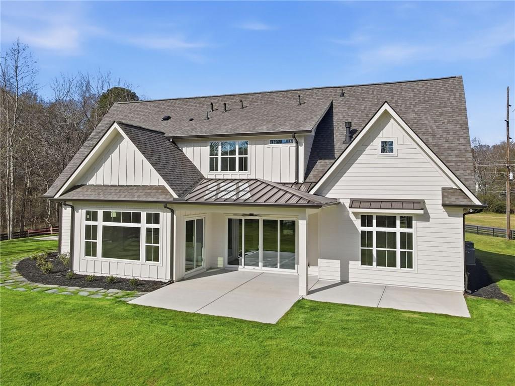 1248 Avery Road Canton, GA 30115 - Photo 7 of 64 a front view of a house with a yard and porch