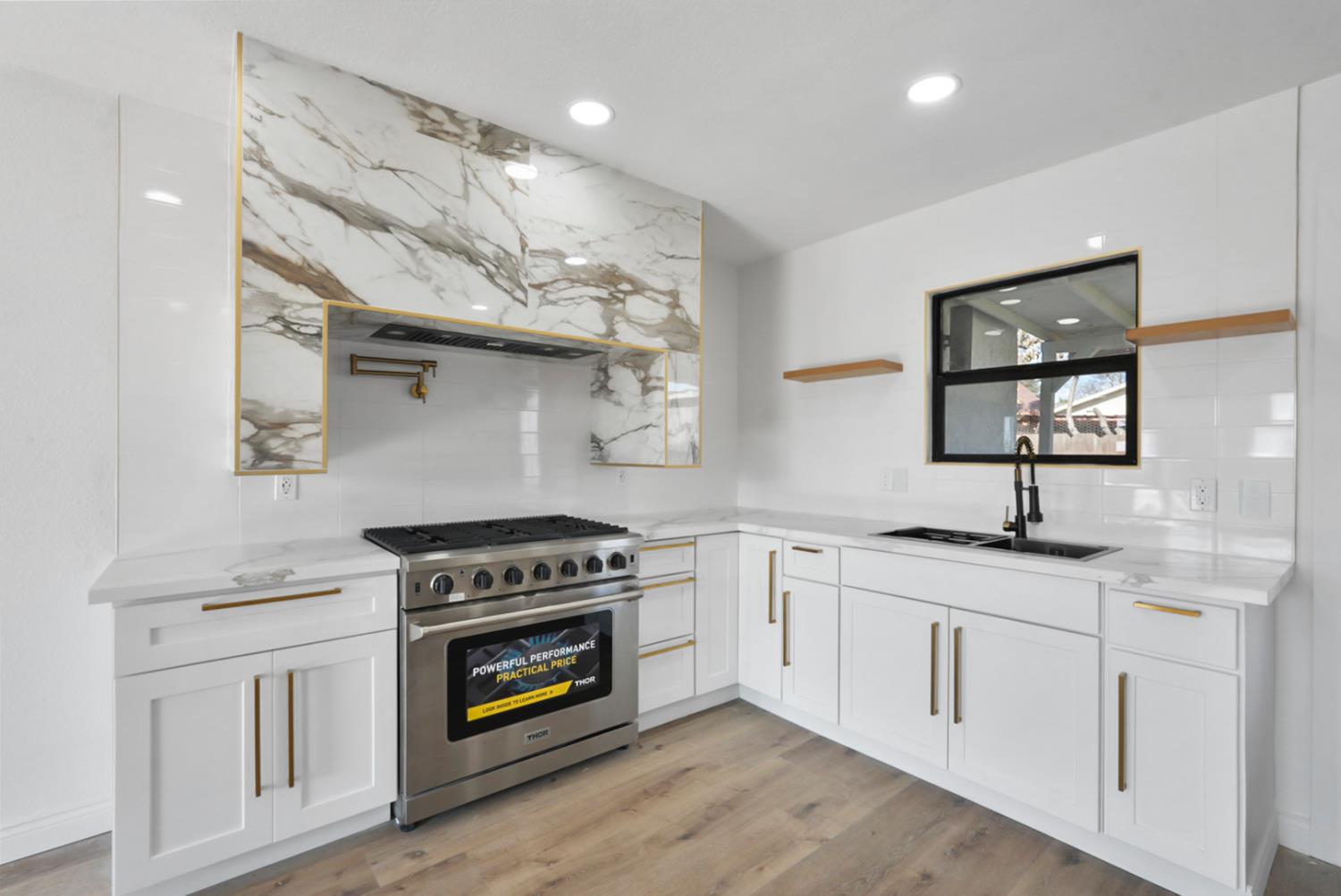 43 Skylark Street Merced, CA 95341 - Photo 2 of 14 a kitchen with white cabinets and appliances