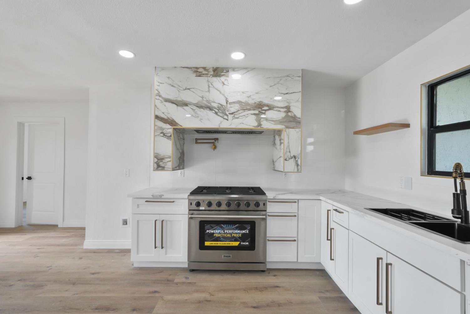 43 Skylark Street Merced, CA 95341 - Photo 3 of 14 a kitchen with cabinets and appliances