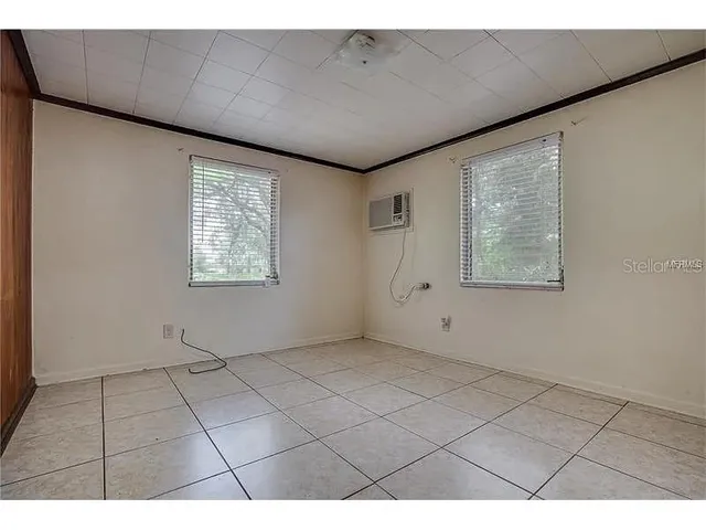 a view of an empty room with a window