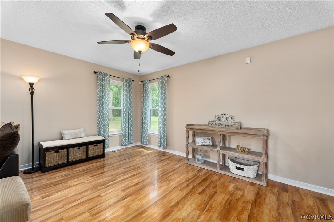 13571 Bailey Bridge Road Midlothian, VA 23112 - Photo 13 of 46 a bedroom with a bed and a chandelier