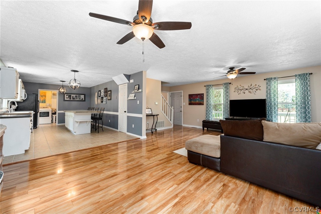 13571 Bailey Bridge Road Midlothian, VA 23112 - Photo 14 of 46 a living room with furniture and a fireplace
